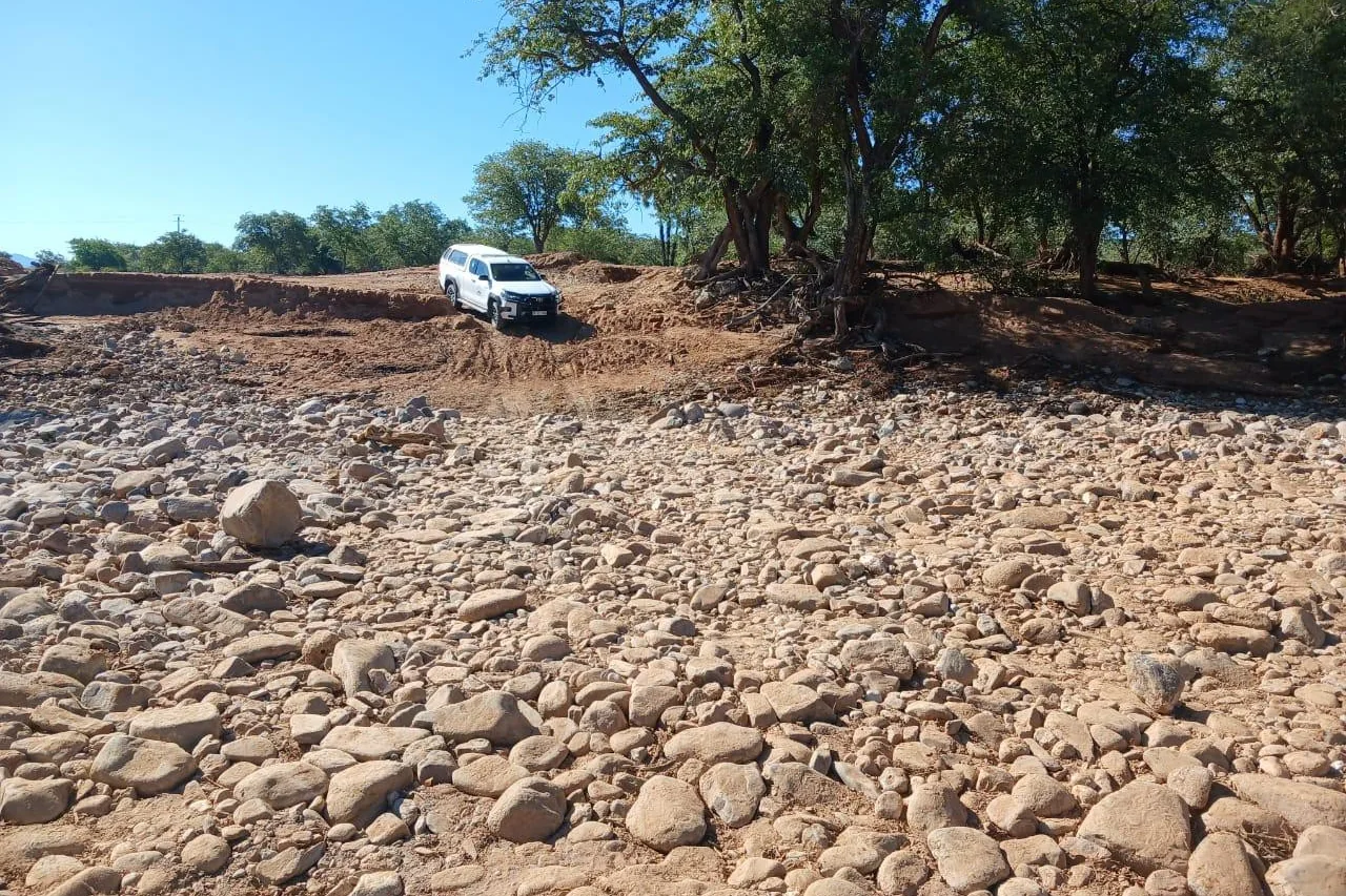 Watercourse crossing on District Road D3703 after flood damage.